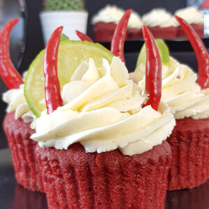 QOTSA inspired Villains red velvet devil cupcakes topped with tequila buttercream