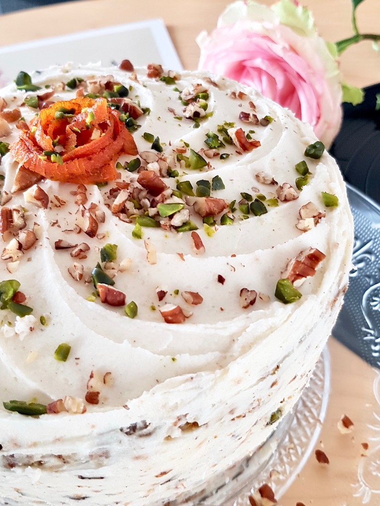 Vegan layer carrot cake with pecan and pistacchio close up