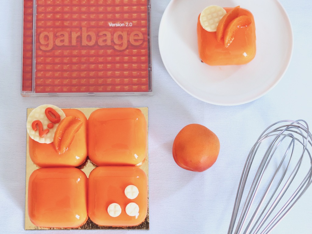 Garbage inspired apricot entremet with orange mirror glaze