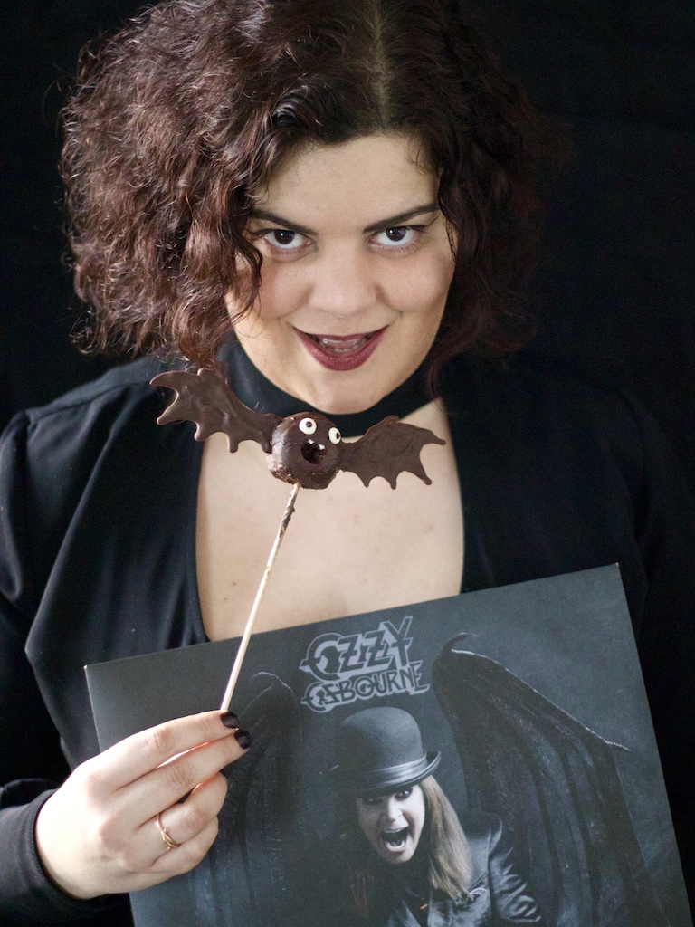 Girl holding chocolate bat and Ozzy Osbourne vinyl