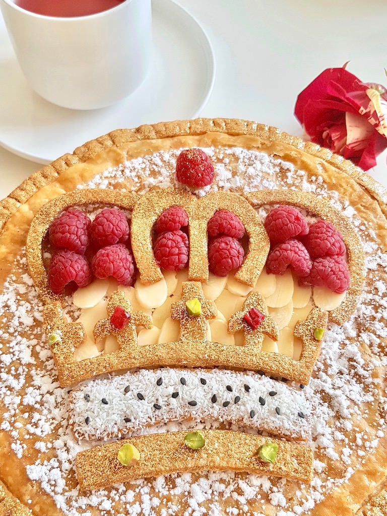 Galette des rois with crown design and raspberries