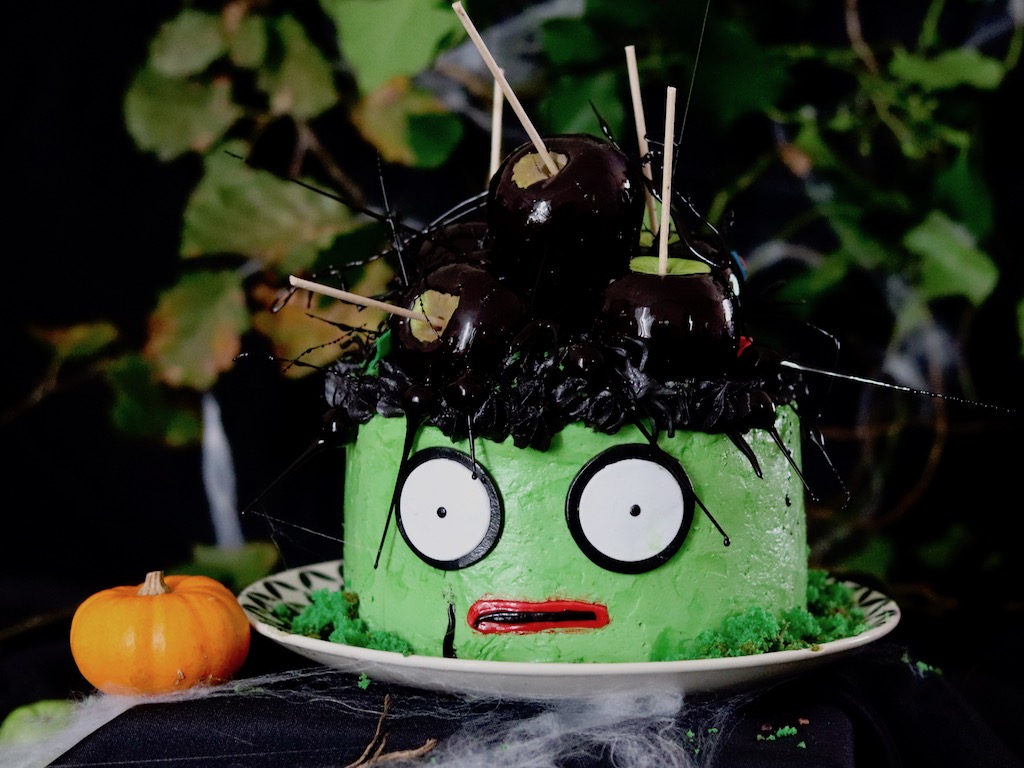 Robert Smith inspired matcha layer cake topped with black apple candy