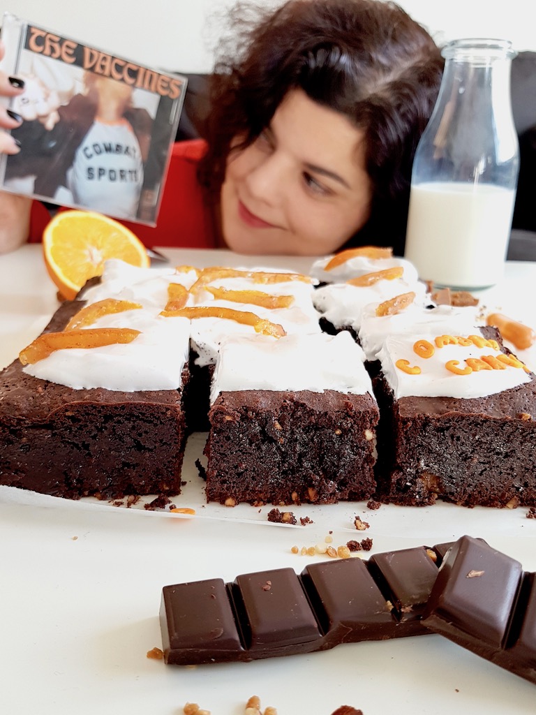 Chocolate brownie covered with marshmallow and candied orange peels