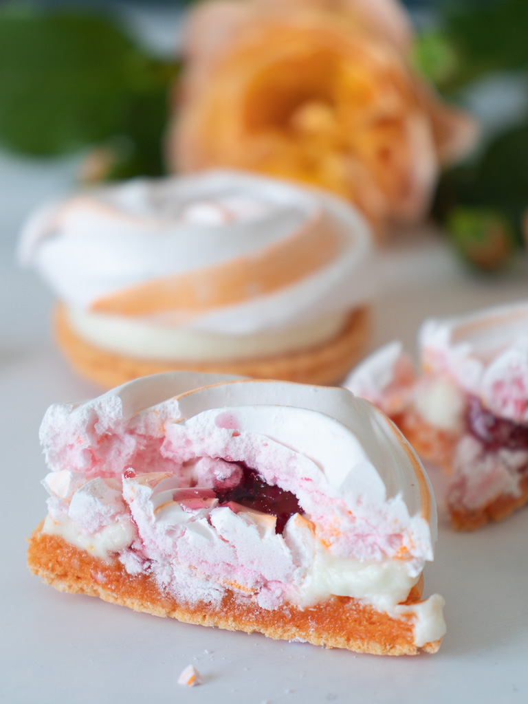 Rose macaron cut with cream and rose jelly