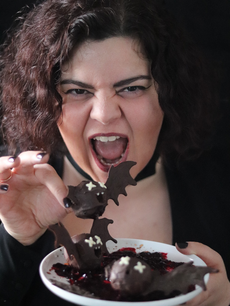 Girl eating bat chocolate truffles