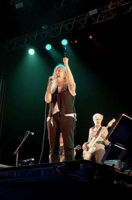 Patti Smith raising her fist on stage at Musicalarue 2019