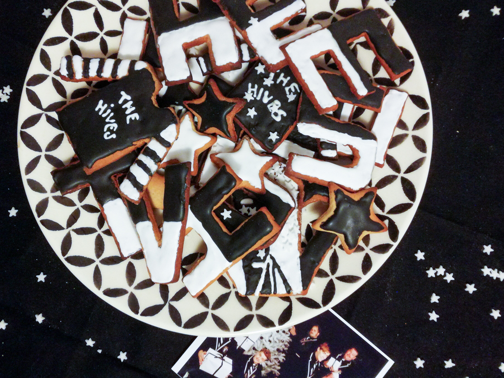 Black and white pepparkakor christmas biscuits inspired by The Hives on a plate. 