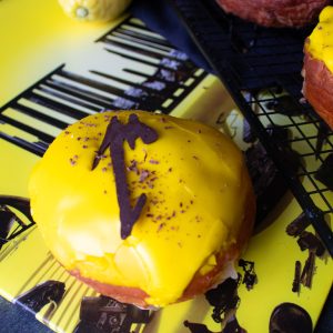 Donuts filled with lemon curd with Metallica album