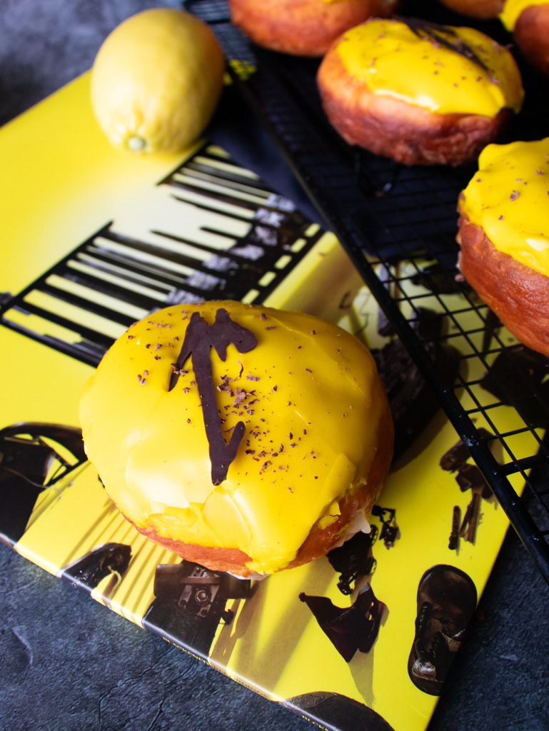 Donuts filled with lemon curd with Metallica album