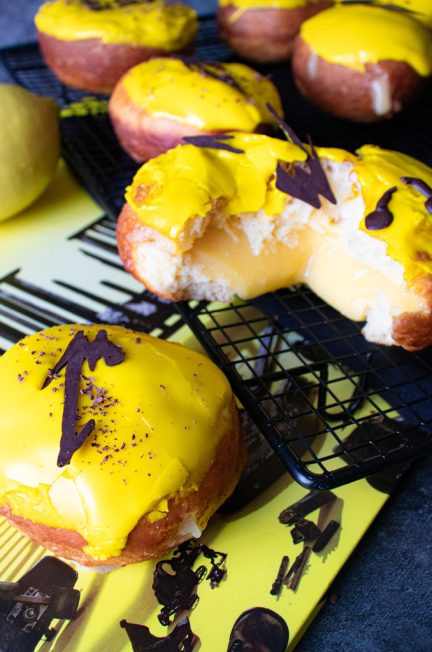 Donuts filled with lemon curd with Metallica album