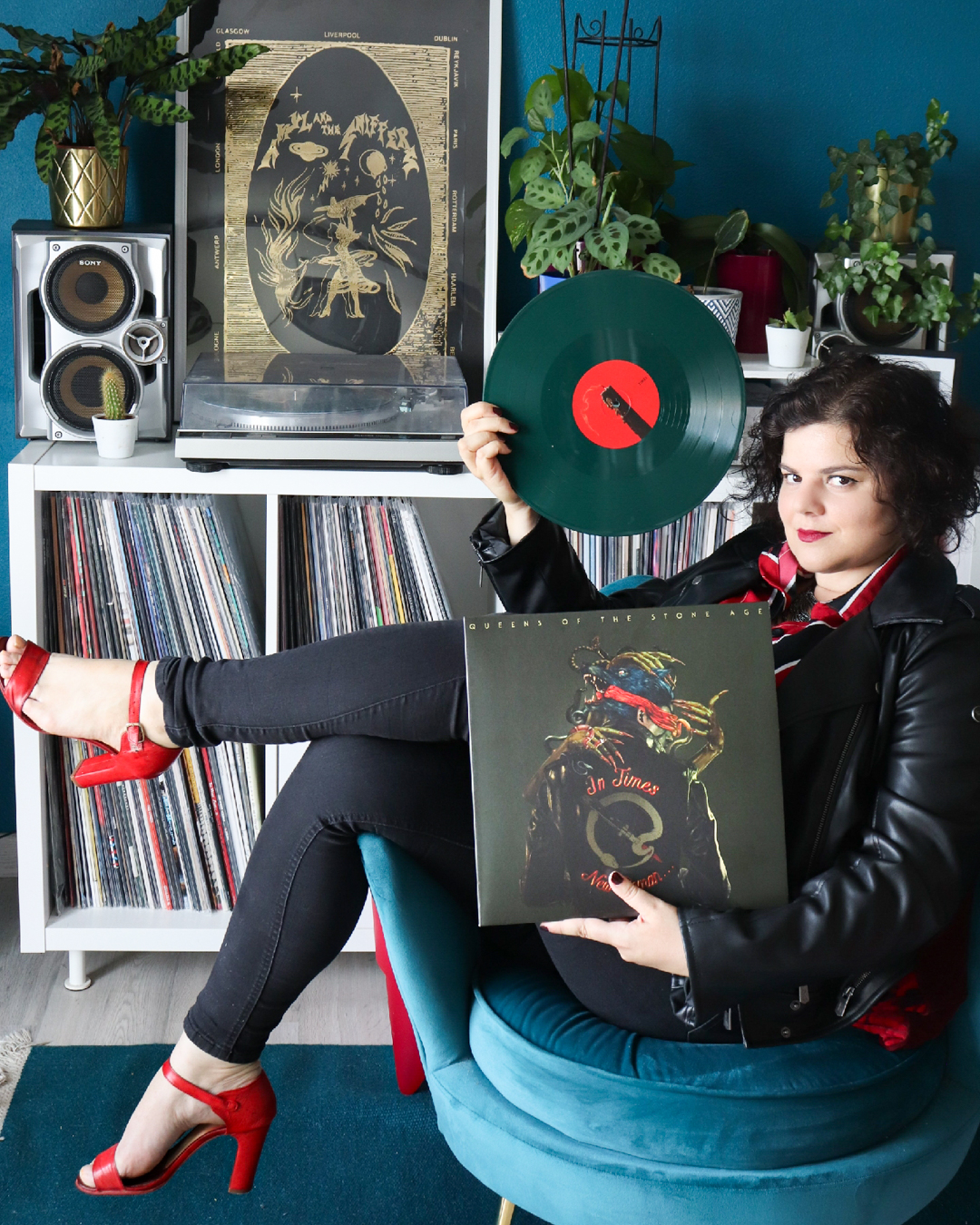 Girl holding Queens of The Stone Age vinyl