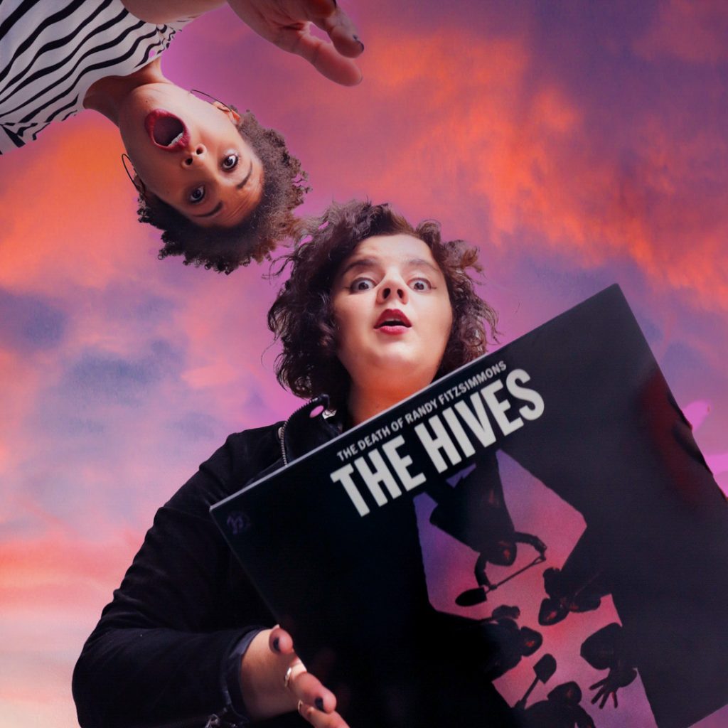 2 girls holding The Hives vinyl The Death of Randy Fitzsimmons