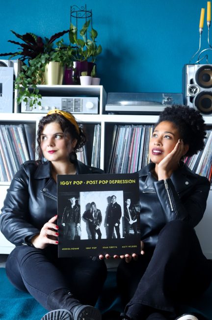 2 girls holding Post Pop Depression vinyl