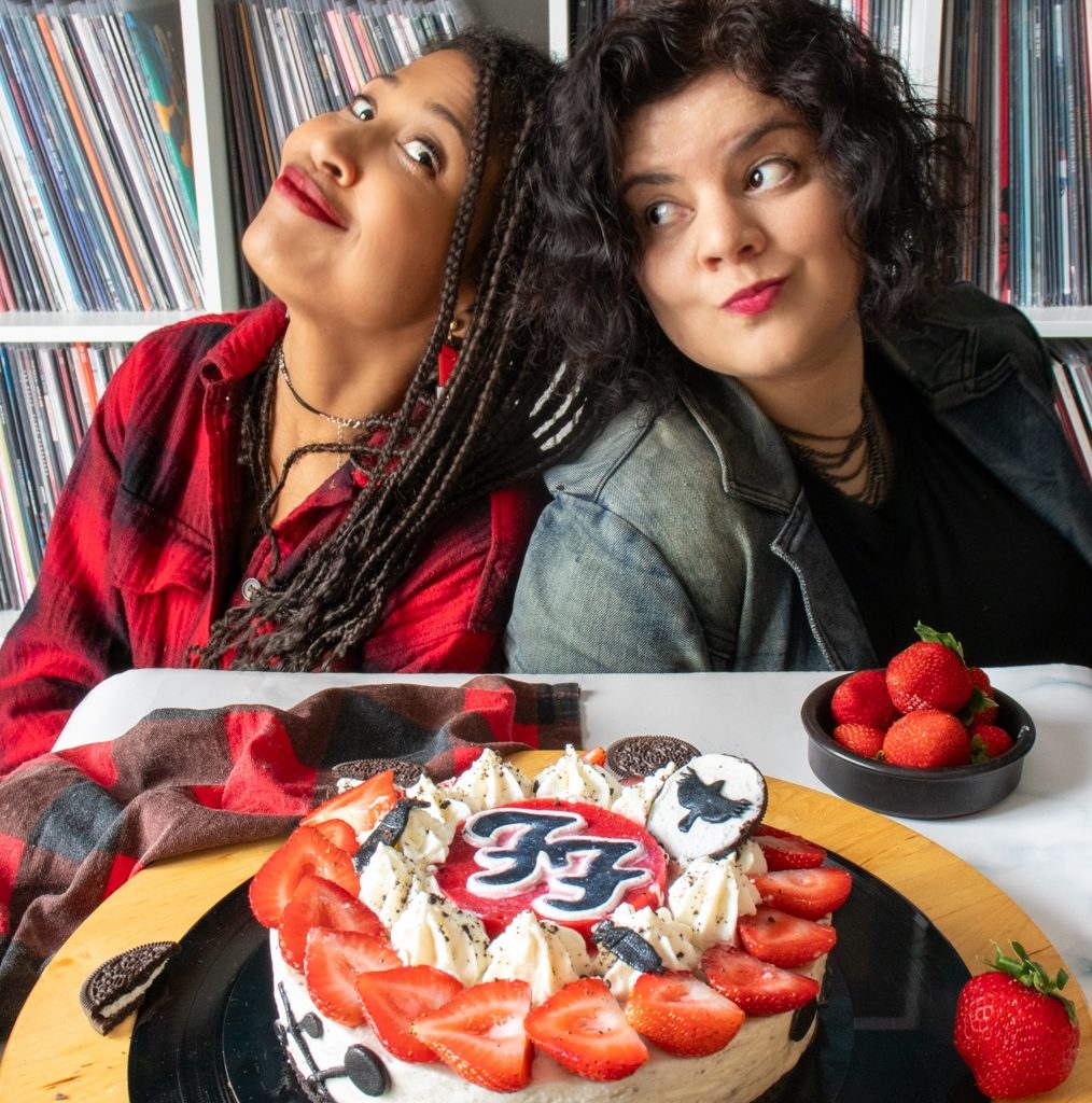 Girls posing with a Foo Fighters inspired oreo strawberry cheesecake