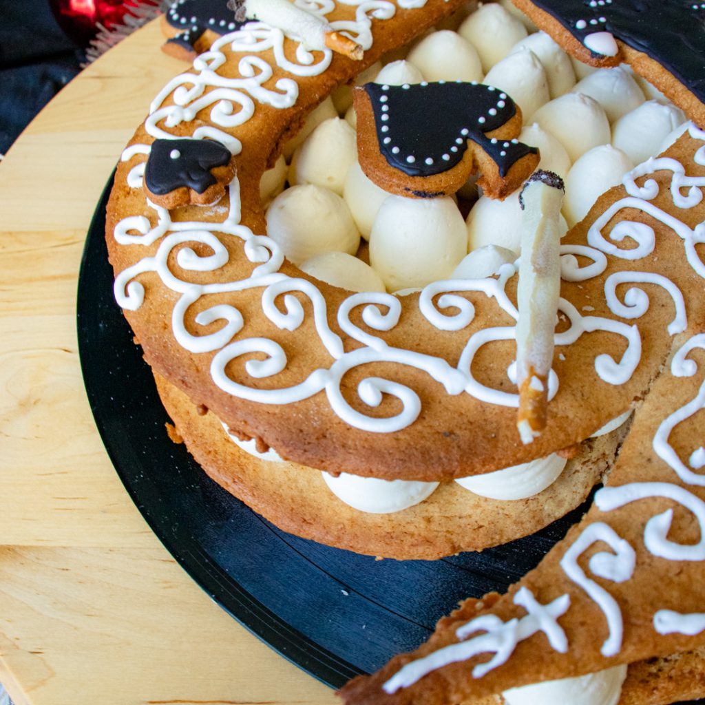 Motorhead inspired cake with gingerbread ace of spades and bretzel cigarettes