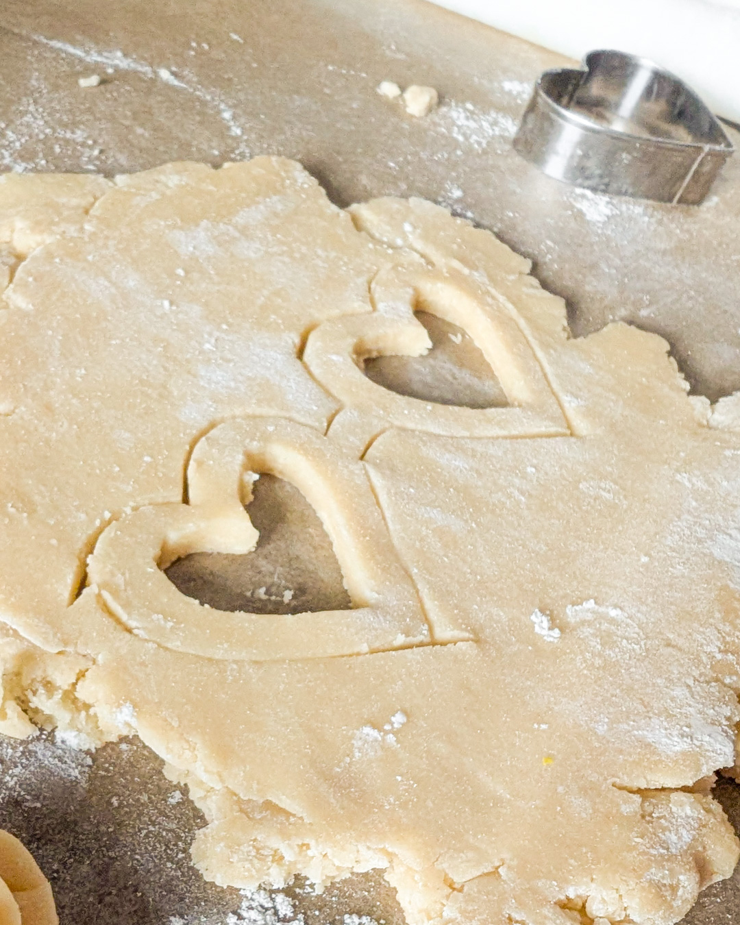 Dough cut for heart shaped sugar cookies glasses