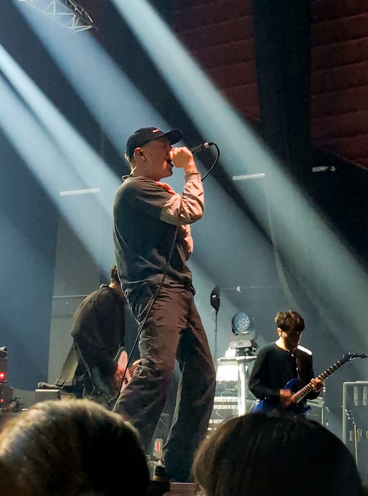 Henry Cox on stage with Boston Manor in Bordeaux