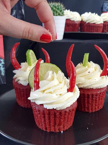 QOTSA inspired Villains red velvet devil cupcakes topped with tequila buttercream