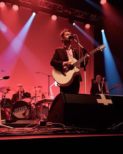 Neil Hannon on stage with The Divine Comedy
