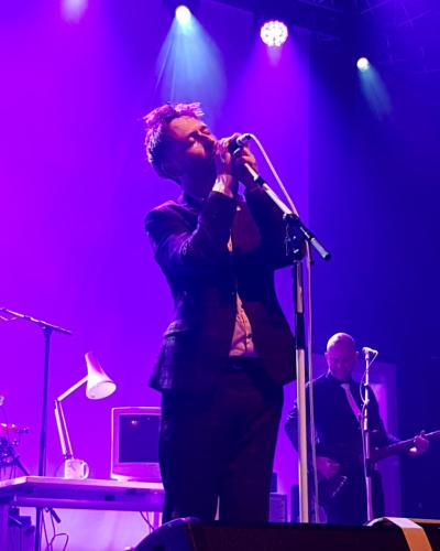 Neil Hannon on stage with The Divine Comedy