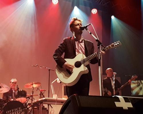 Neil Hannon on stage with The Divine Comedy