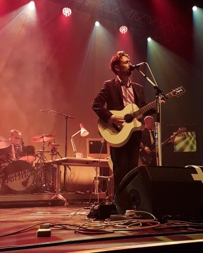 Neil Hannon on stage with The Divine Comedy
