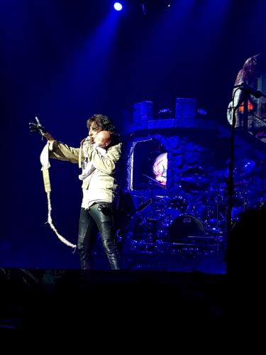 Alice Cooper in a camisole with doll on stage in Bordeaux 2019