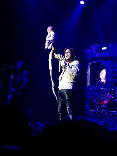 Alice Cooper in a camisole with doll on stage in Bordeaux 2019