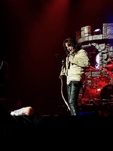 Alice Cooper in a camisole with doll on stage in Bordeaux 2019