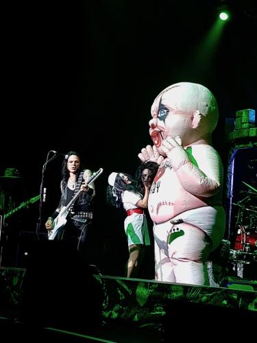 Sheryl Cooper, Chuck Garric and giant baby on stage at Alice Cooper show in Bordeaux 2019