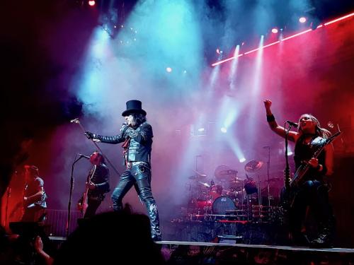 Alice cooper wearing black hat and band on stage in Bordeaux 2019