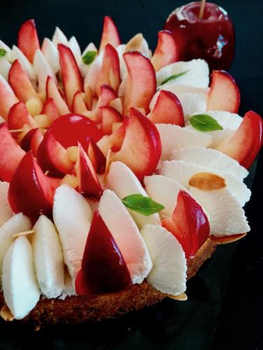 Graphic cake with whipped cream and candy apples detail