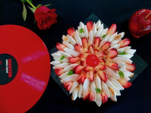 Graphic cake with whipped cream candy apples and Anna Calvi Hunter vinyl