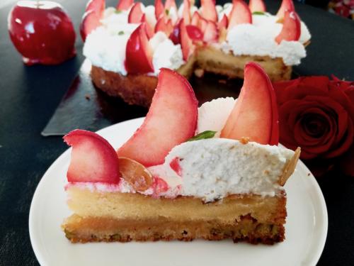 Graphic cake with whipped cream and candy apples slice