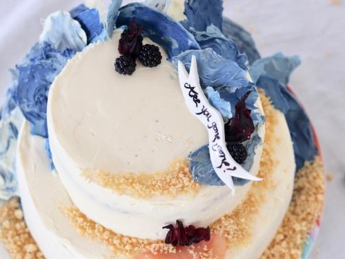 Layer cake with chocolate decorations imitating waves from top