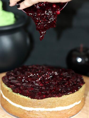 Layer cake topped with homemade raspberry jam