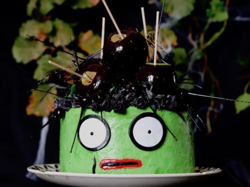 Robert Smith inspired matcha layer cake topped with black apple candy