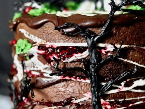 Chocolate layer cake filled with red berries detail