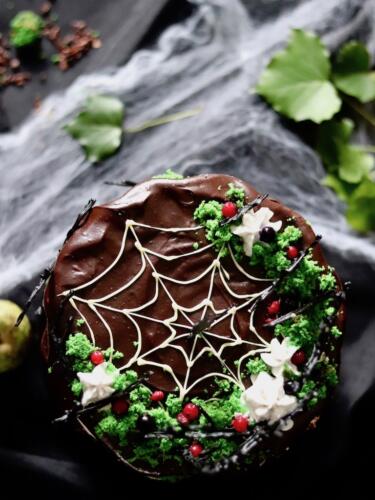 Chocolate layer cake with white chocolate spider web