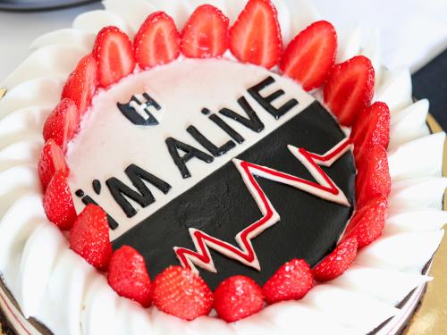 Graphic vegan cheesecake topped with strawberries and aquafaba meringue close up