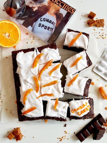 Chocolate brownie covered with marshmallow and candied orange peels