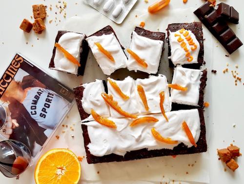 Chocolate brownie covered with marshmallow and candied orange peels