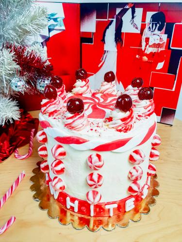 The White Stripes inspired red velvet layer cake next to Elephant vinyl record