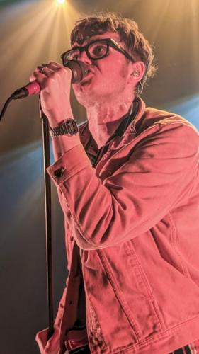 James Smith on stage with Yard Act