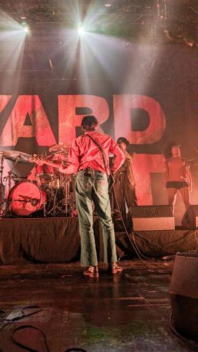 Ryan Needham on stage with Yard Act