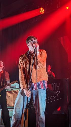 James Smith on stage with Yard Act