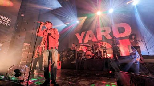 James Smith on stage with Yard Act