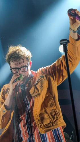 James Smith on stage with Yard Act