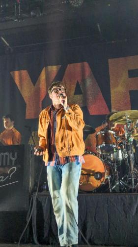 James Smith on stage with Yard Act 2024